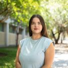 Isabella Buckner standing outdoors on the UC Davis Campus